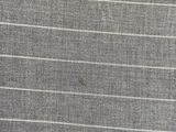 a close up of a gray and white striped fabric