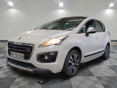 the small white car is parked in a large room