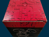 a red box that has a bunch of pieces of puzzle on it