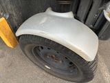 a close up of a tire on a forklift