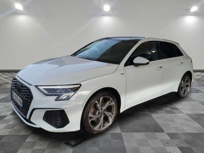 a white audi q3 parked on a checkered tile floor
