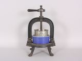 a blue bowl sitting on top of a metal stand