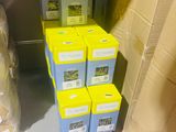 many boxes that are sitting on a shelf in a room