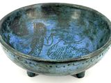 a blue bowl with a picture of a man and a woman on it