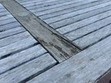 a wooden table with a wooden cross on it