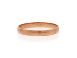 a close up of a gold ring on a white background