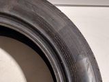 a close up of a tire on a white surface