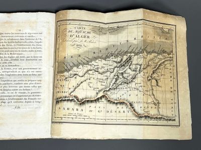 an old book with a map of the world on it