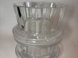 a clear glass bowl with a toothbrush inside of it