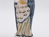 a figurine of a woman holding a baby