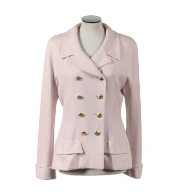 pink jacket with gold buttons on a mannequin torso