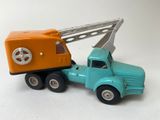 a toy truck with a crane on the back of it