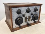 an old radio sitting on top of a table