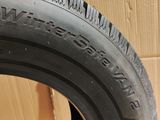a close up of a tire on a cardboard box with a cardboard box in the background