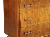 an image of a wooden chest of drawers on a white background
