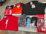 a lot of clothing and gloves on a table