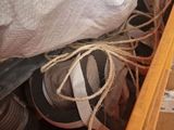 a wooden box with a bunch of shoes inside of it
