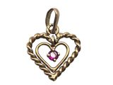 un pendentif en or en forme de cœur, orné d'une pierre rose en son centre
