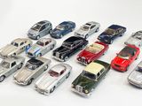 a lot of toy cars that are on a white surface
