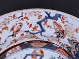 an image of a plate with birds and flowers on it