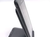a cell phone that is sitting on top of a stand