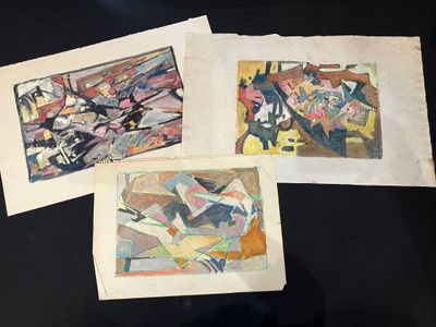 three paintings on a table with a black table cloth