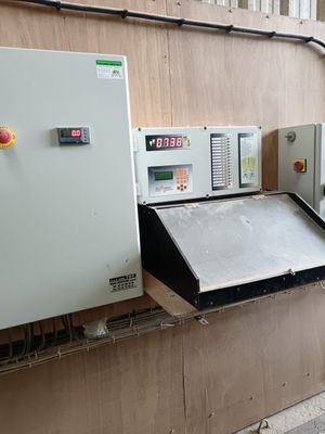 a machine that is sitting on the side of a building