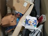 a cardboard box full of assorted items in it