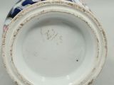 an old porcelain vase with a blue and white design on it