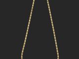 un collier en or avec une chaîne sur fond noir