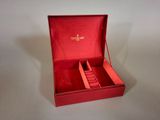 a red box that has a watch inside of it
