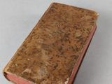 an old book that is sitting on a table