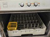 an image of a dishwasher with a basket in it