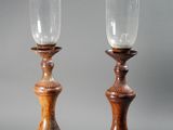 pair of antique wooden candlesticks with glass holders