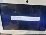 a computer screen with a message on it sitting on a desk