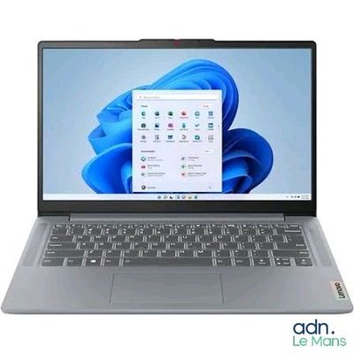 l'ordinateur portable est ouvert sur une surface blanche avec un fond bleu