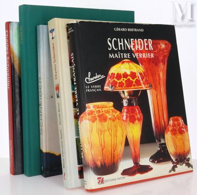 three books that are sitting next to each other on a table
