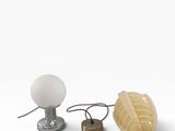 a lamp that is sitting next to a lamp that is on a table