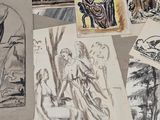 de nombreux dessins représentant des personnes et des animaux posés sur une table