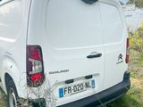a white van that is parked in the grass
