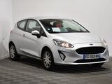 a white ford fiesta parked in a room with a checkered floor