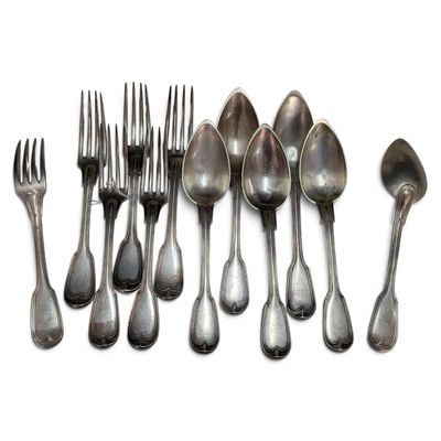 a lot of spoons and forks on a white surface