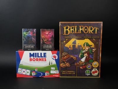 trois jeux de société posés les uns à côté des autres sur une table