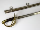 two old swords are laying next to each other on a white surface