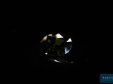 a diamond in the dark with a black background