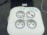 an image of a white power strip with four plugs