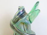a glass vase with a spiral design on it