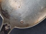 a silver spoon that has been left on the table