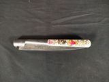 a knife that is laying on a black cloth