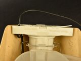 a white blender sitting on top of a wooden box